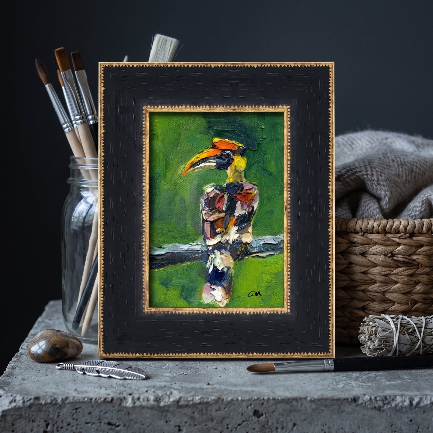 Minimalist studio — Expressive hornbill painting adds vibrant color and artistic energy to a serene creative workspace