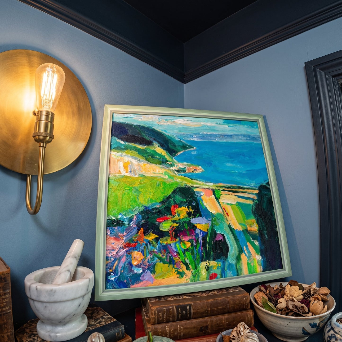 Eclectic study — vibrant Impressionist landscape painting transforms the space with bold color and texture under warm lamplight