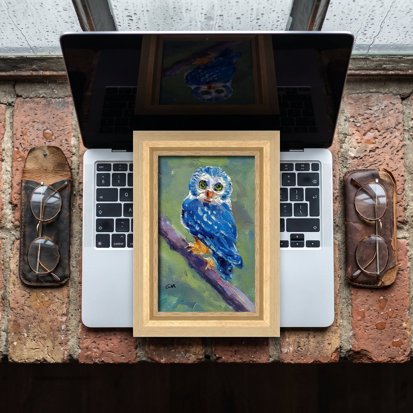 RusticIndustrialStudy — Original expressionist owl painting brings vibrant color and soulful focus to a weathered brick workspace