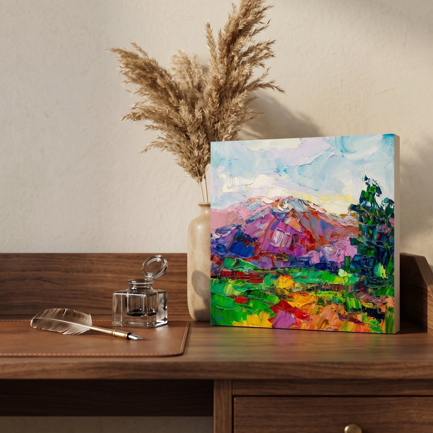 Minimalist home office — Vibrant expressionist landscape painting adds color and energy to a serene workspace
