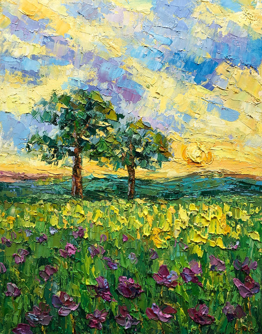 Hand-painted oil landscape of a vibrant spring meadow with purple flowers, two trees, and a golden sky; unframed canvas on neutral surface