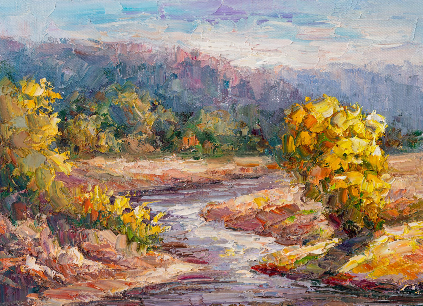 Impressionist oil painting of a river landscape with vibrant yellow foliage, blue sky, and textured brushwork on unframed canvas