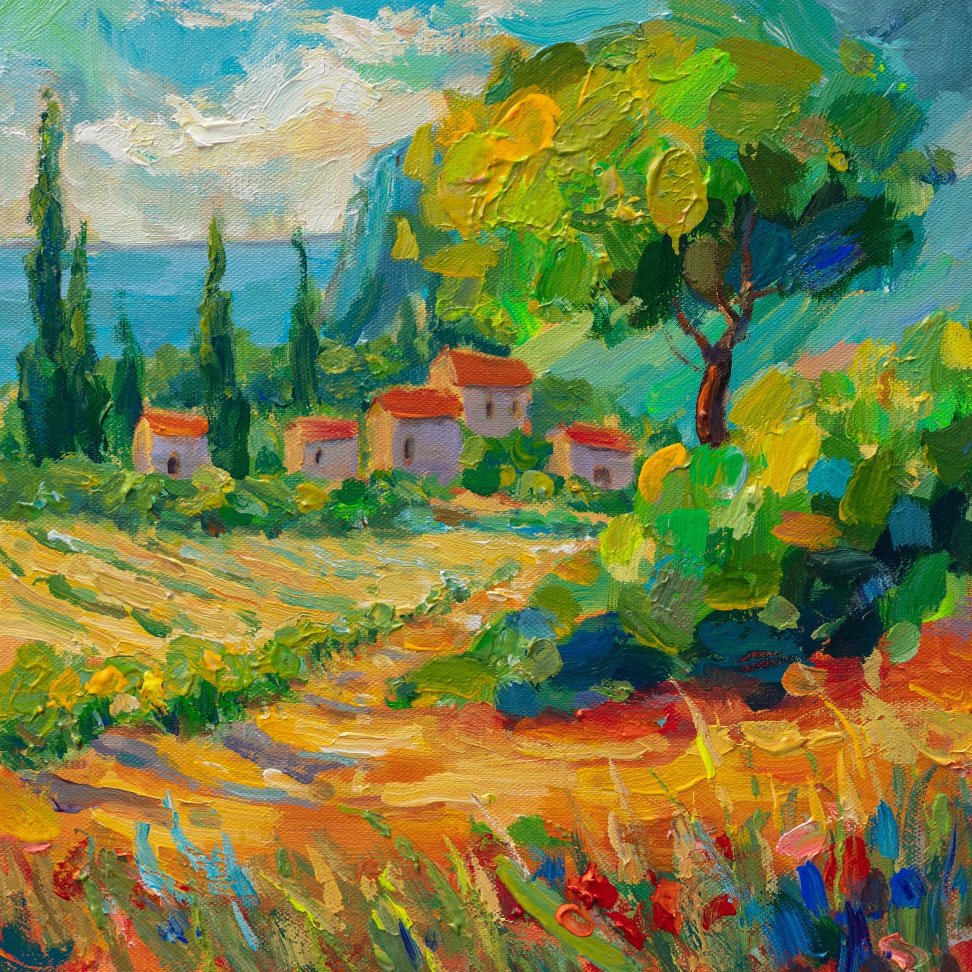 Vibrant oil painting of a Mediterranean village with lush greenery, terracotta-roofed houses, and a coastal view; unframed canvas on neutral surface
