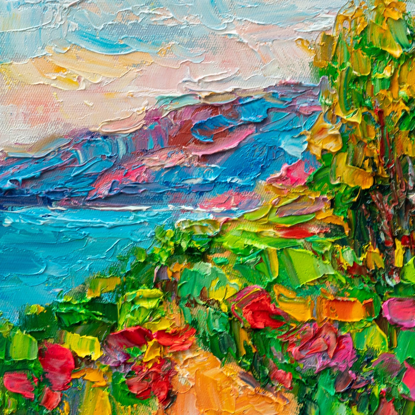 Unframed oil painting on canvas depicting a vibrant coastal garden with thick impasto texture, featuring bold blues, greens, and reds in an abstract landscape composition