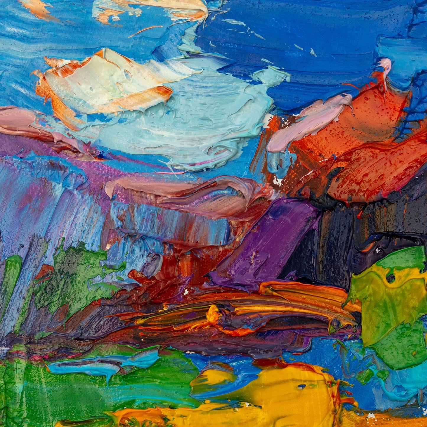 Bold abstract oil painting on canvas with thick impasto texture, vibrant blues, reds, greens, and yellows, unframed and displayed flat on a neutral surface