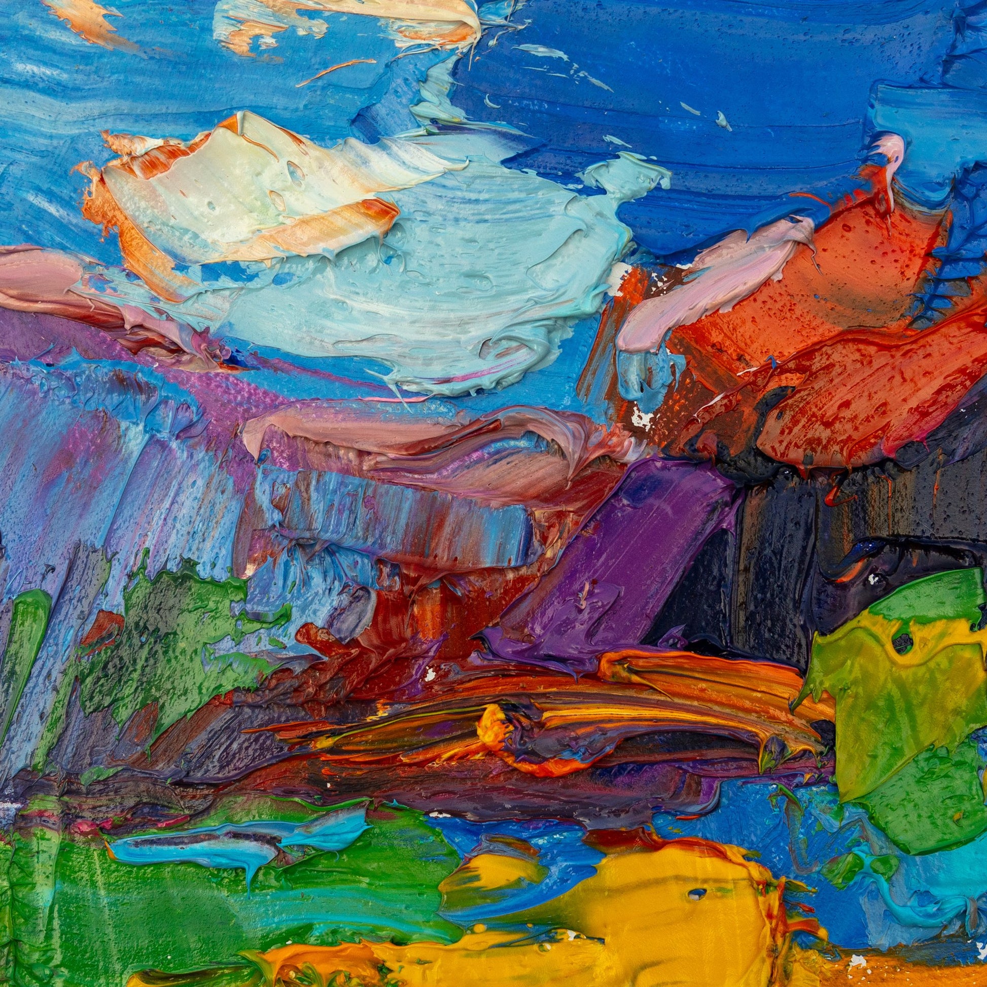 Bold abstract oil painting on canvas with thick impasto texture, vibrant blues, reds, greens, and yellows, unframed and displayed flat on a neutral surface