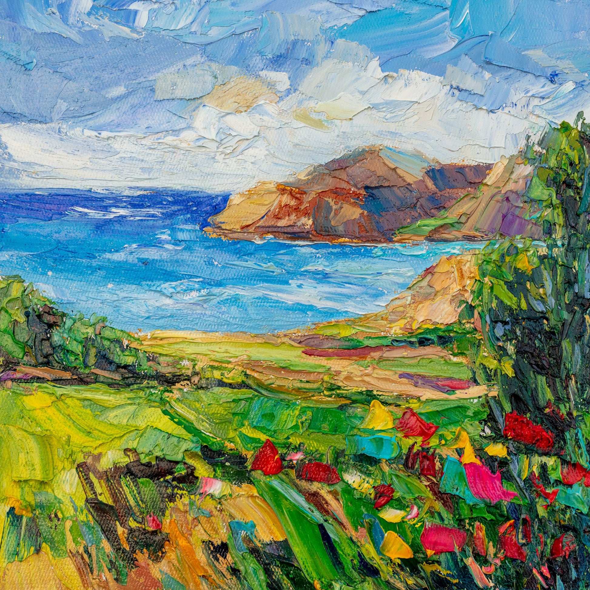 Vibrant coastal landscape oil painting on canvas, unframed, featuring bold brushstrokes of blue sea, green hills, and red flowers under a dynamic sky