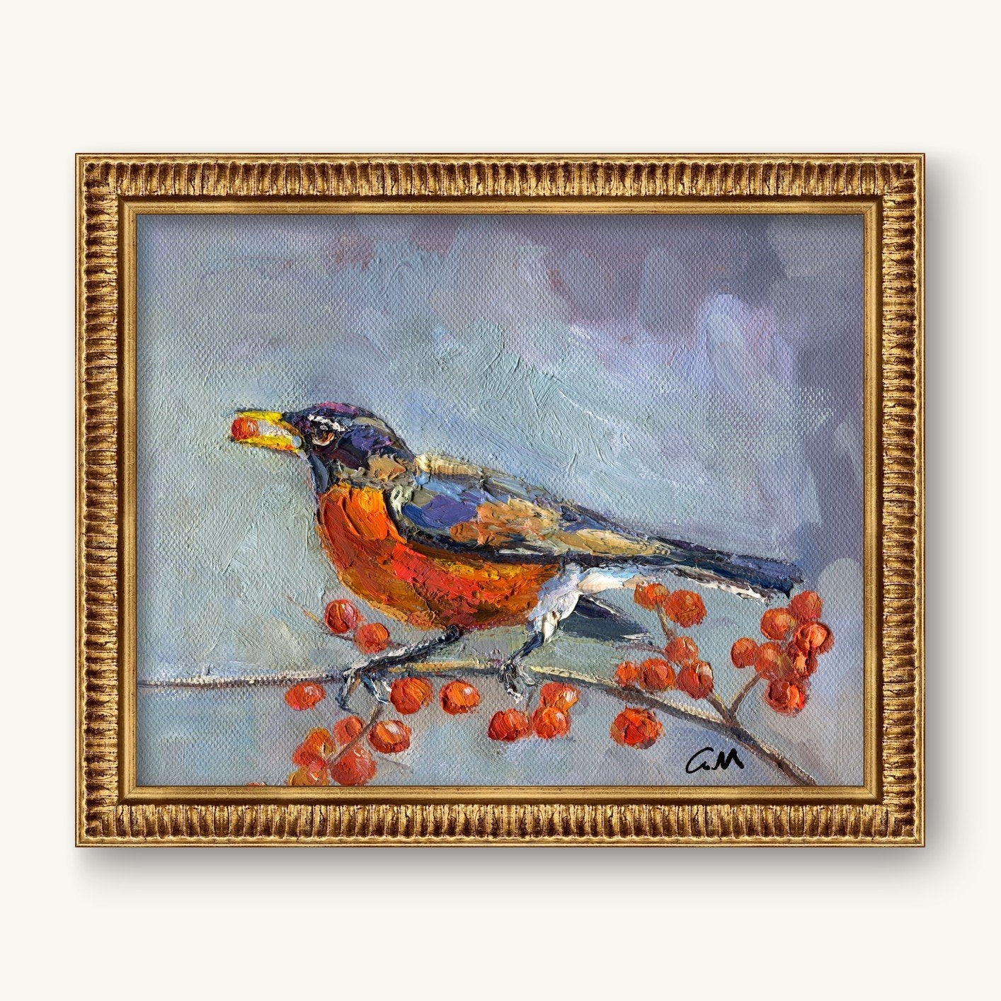 Framed oil painting of a robin perched on a berry-laden branch, signed by artist, in ornate gold frame against neutral wall
