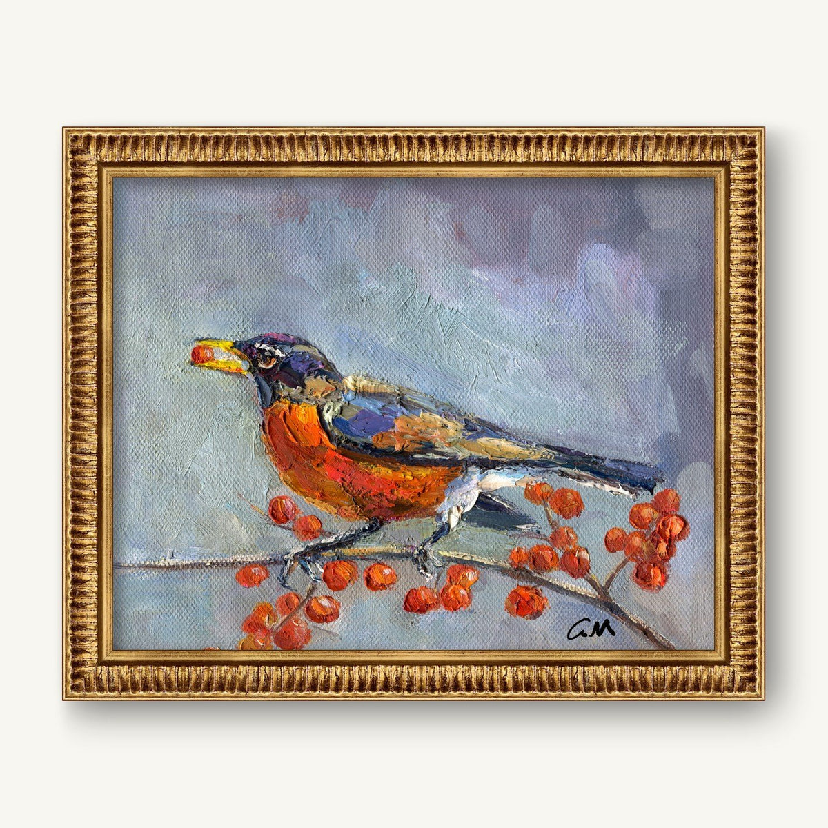 Framed oil painting of a robin perched on a berry-laden branch, signed by artist, in ornate gold frame against neutral wall