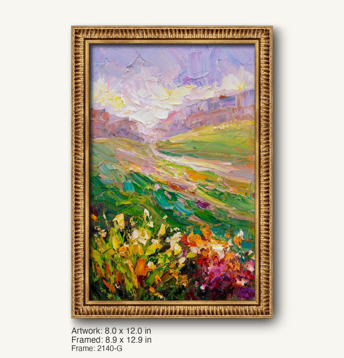 Vertical oil painting of a vibrant meadow landscape with floral foreground and rolling hills under a soft sky, displayed in a warm gold ornate frame with textured profile