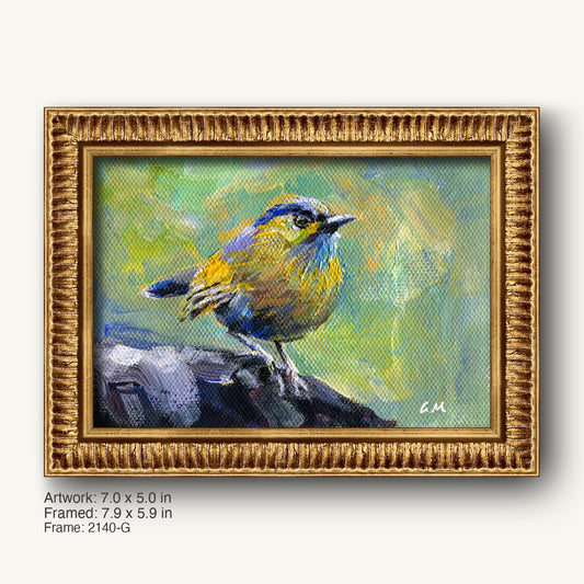 Hand-painted bird portrait in ornate gold frame, featuring a vibrant blue and yellow bird perched on rock against a textured green background