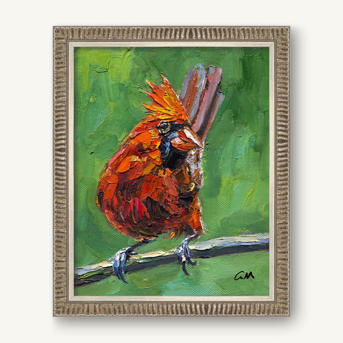 Vibrant oil painting of a red cardinal bird perched on a branch, framed in textured silver frame against white background