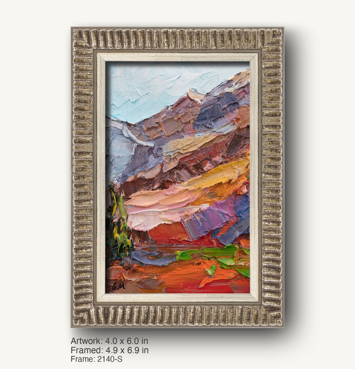 Vertical oil painting of a vibrant canyon landscape in warm reds, oranges, and blues, framed in a textured silver-gray ornate frame with ribbed profile