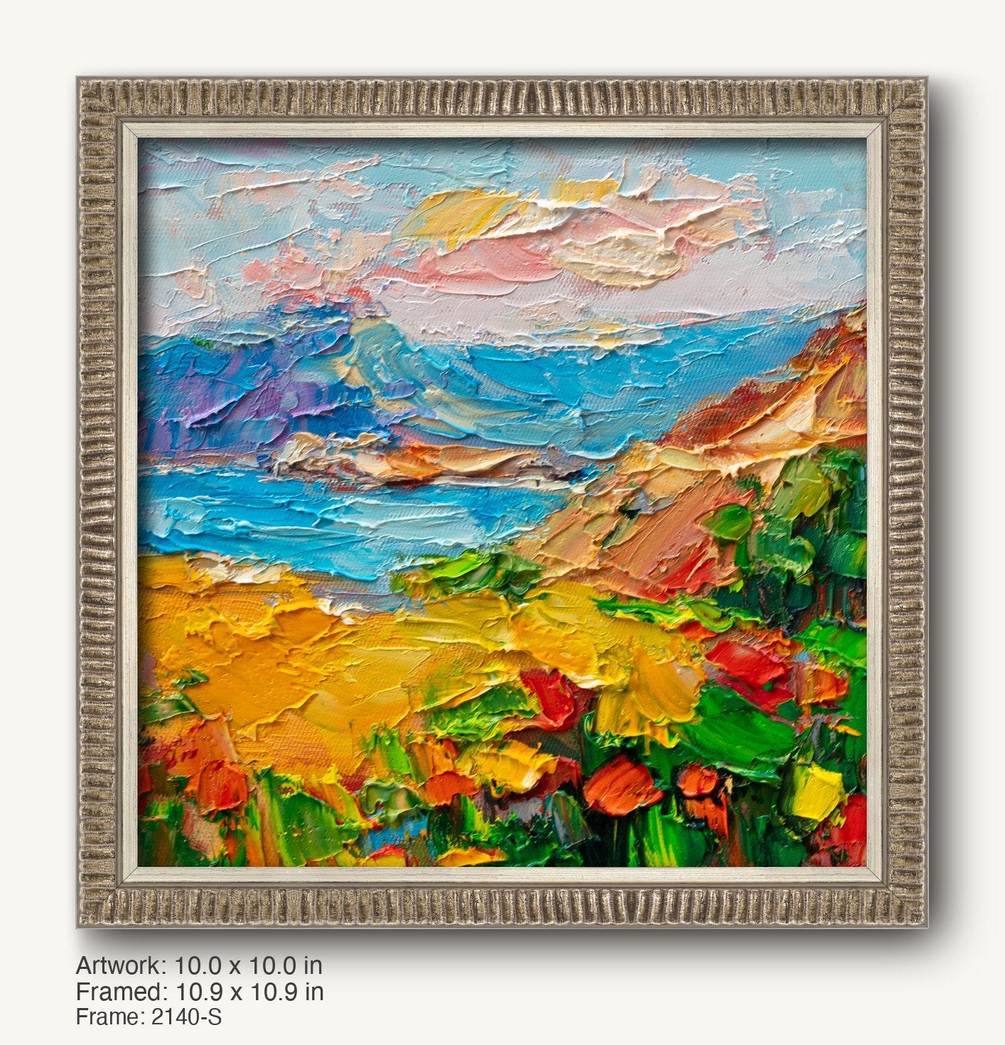 Hand-painted coastal sunset in a textured silver frame, featuring vibrant blues, yellows, and greens with thick impasto brushwork on canvas