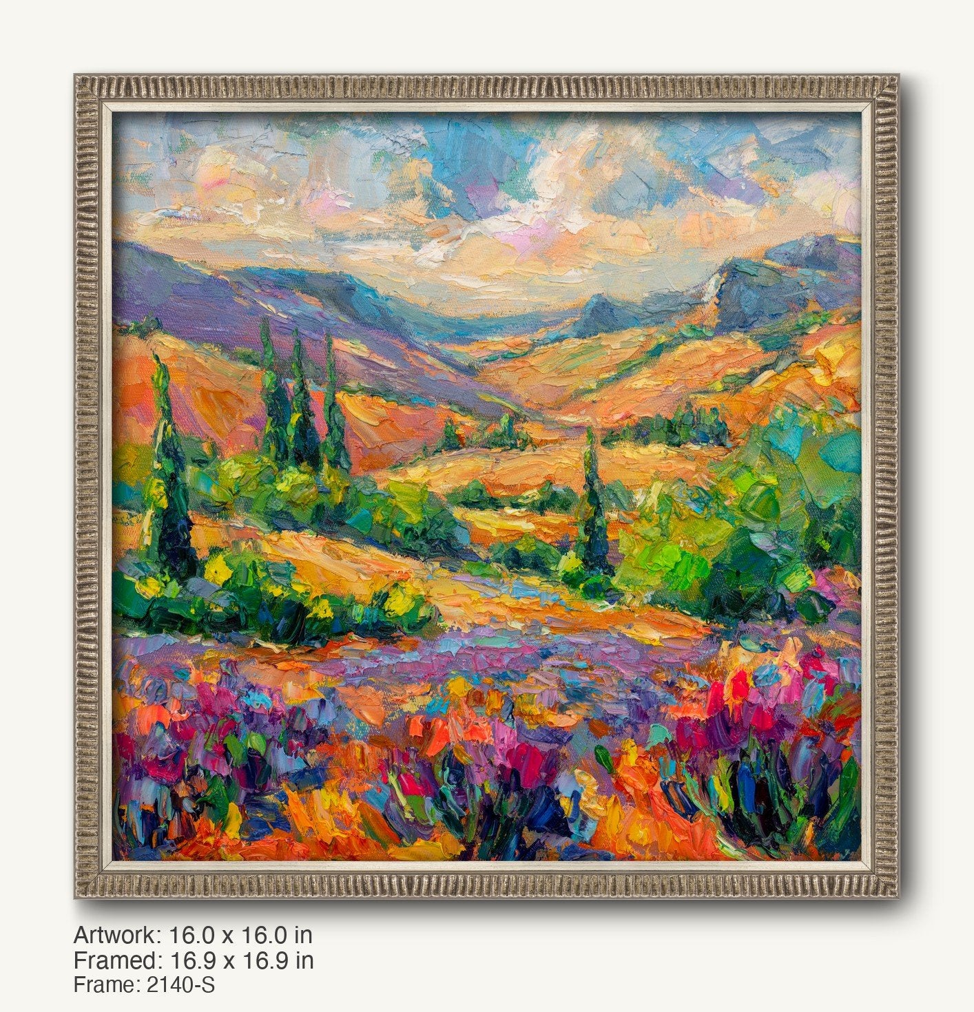 Vibrant autumn meadow landscape painting in a silver-toned ornate frame, featuring rolling hills, colorful wildflowers, and distant mountains under a soft sky.