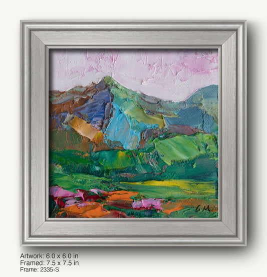 Hand-painted mountain landscape in a modern slim silver frame, featuring vibrant green, blue, and pink hues with textured oil brushwork on canvas