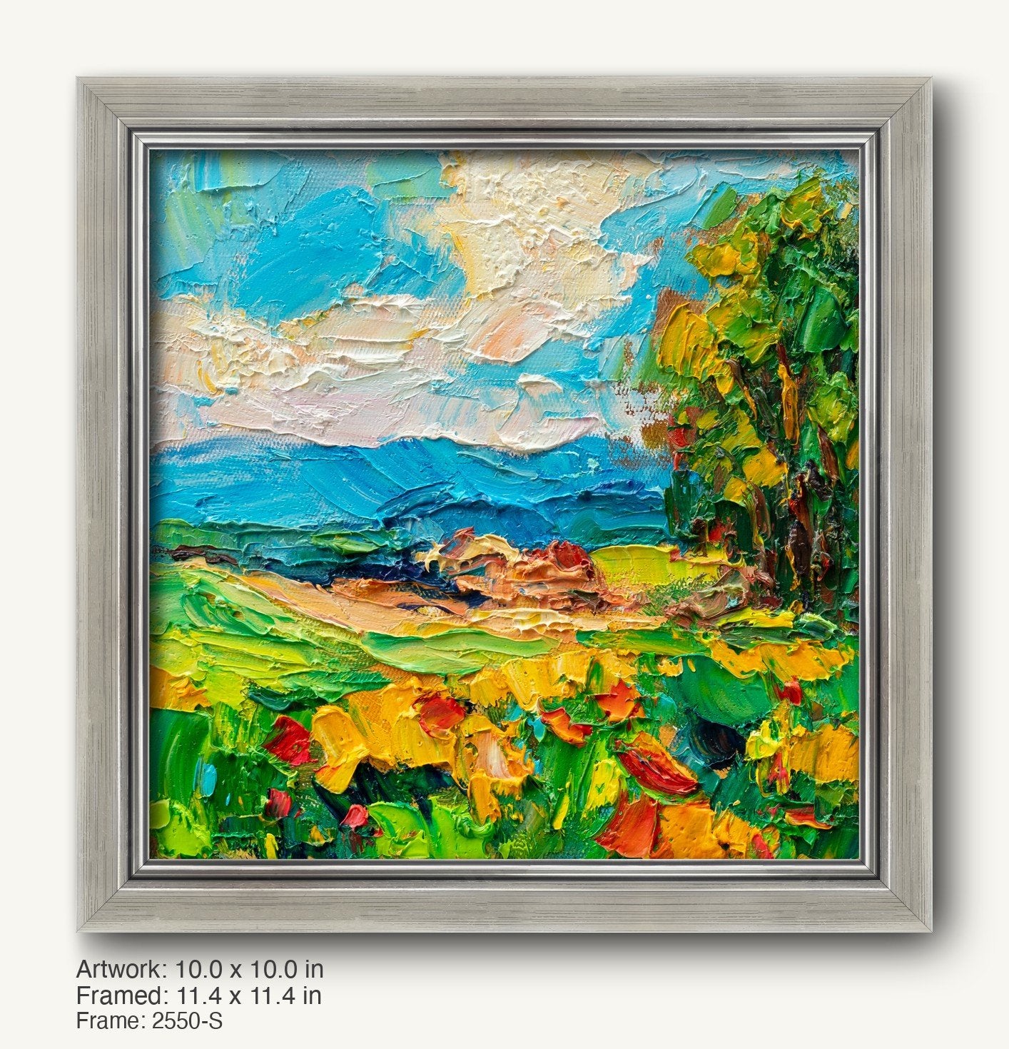Vibrant coastal landscape oil painting in a cool silver modern slim frame, featuring textured brushwork with blue skies, green fields, and yellow flowers