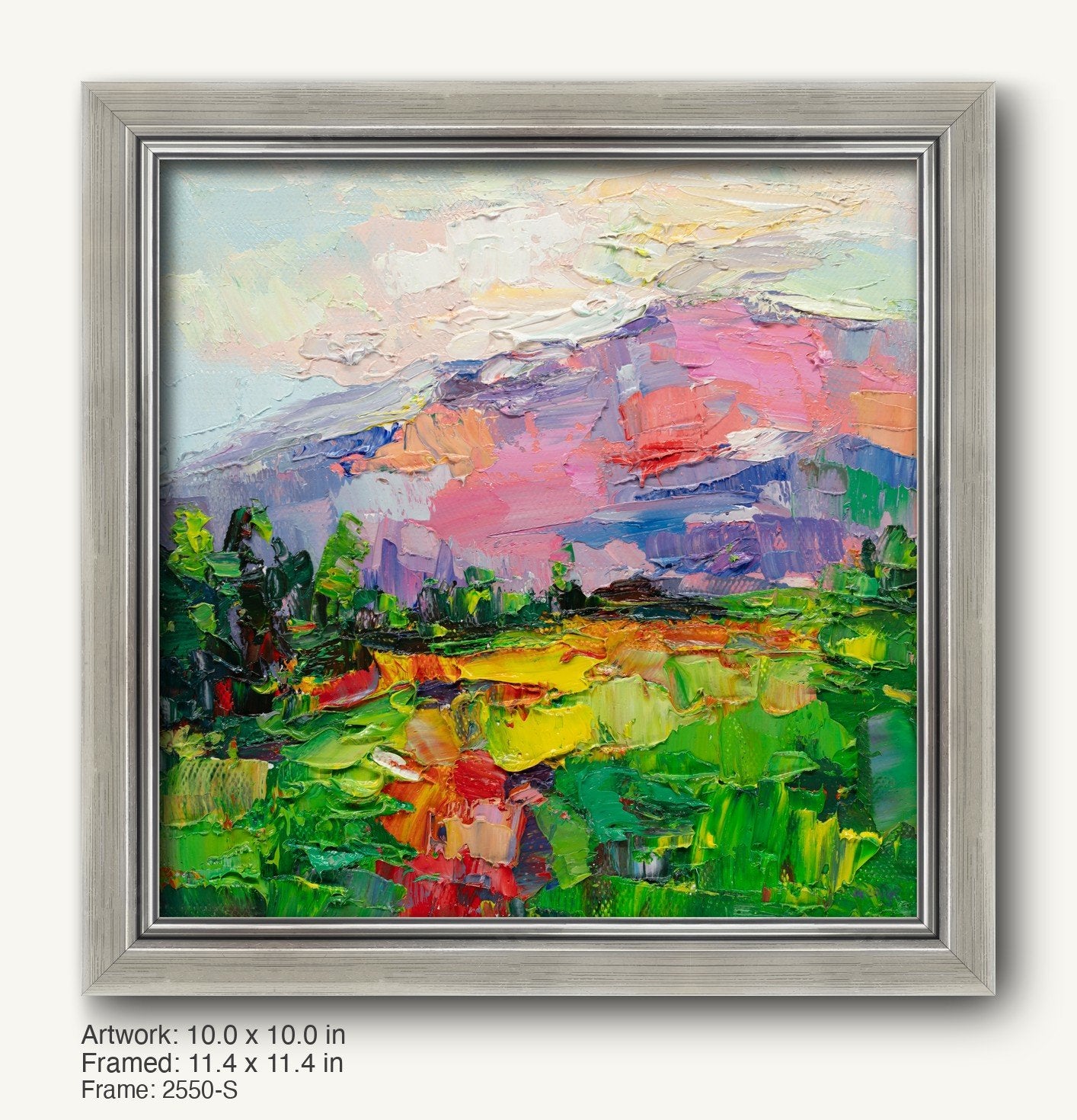 Vibrant impasto landscape painting of a mountain sunset in a cool silver ornate frame, featuring bold greens, pinks, and blues on canvas