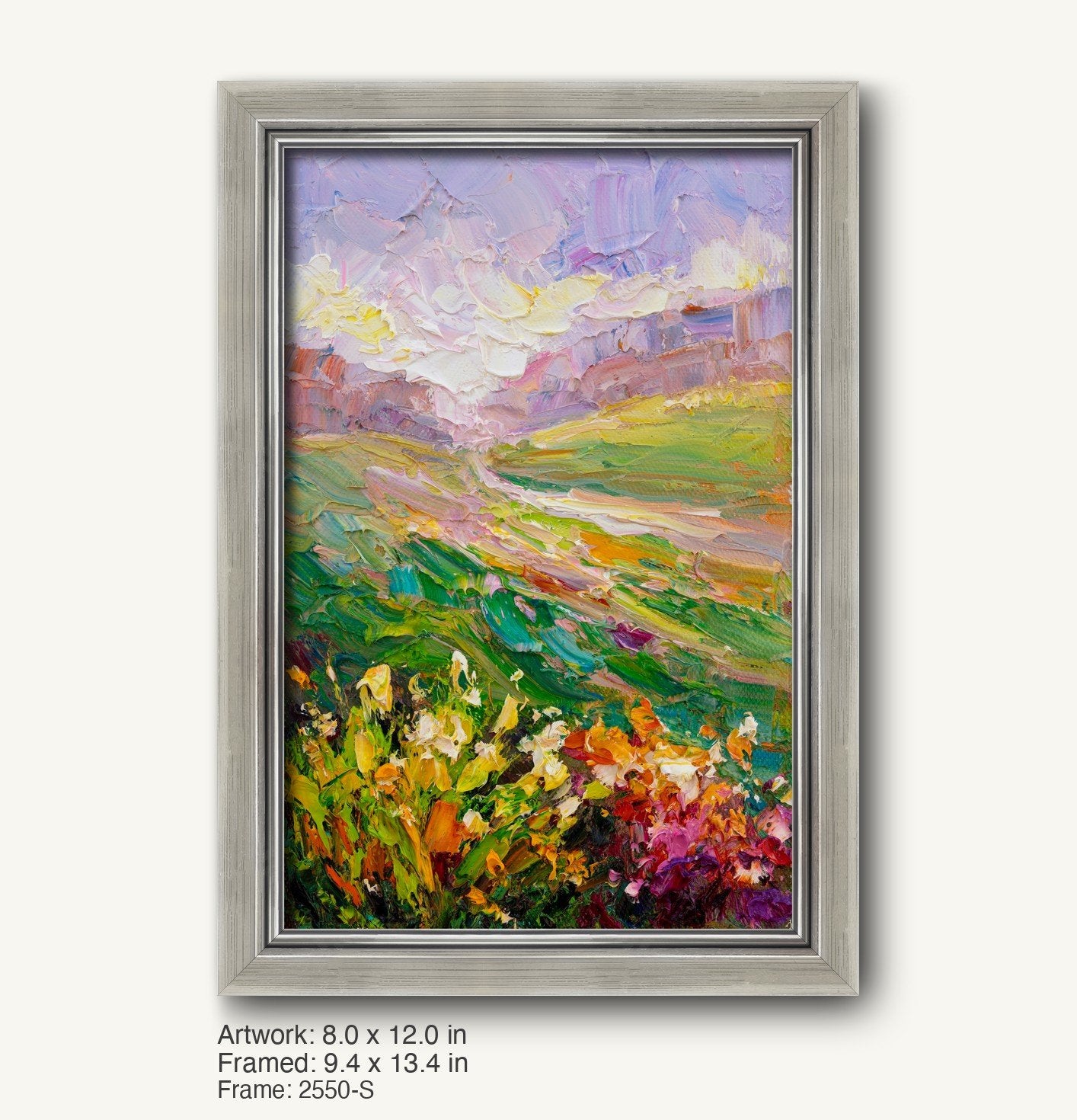 Vertical oil painting of a vibrant meadow landscape with floral foreground and rolling hills under a pastel sky, displayed in a modern slim silver frame with brushed texture and clean inner edge.