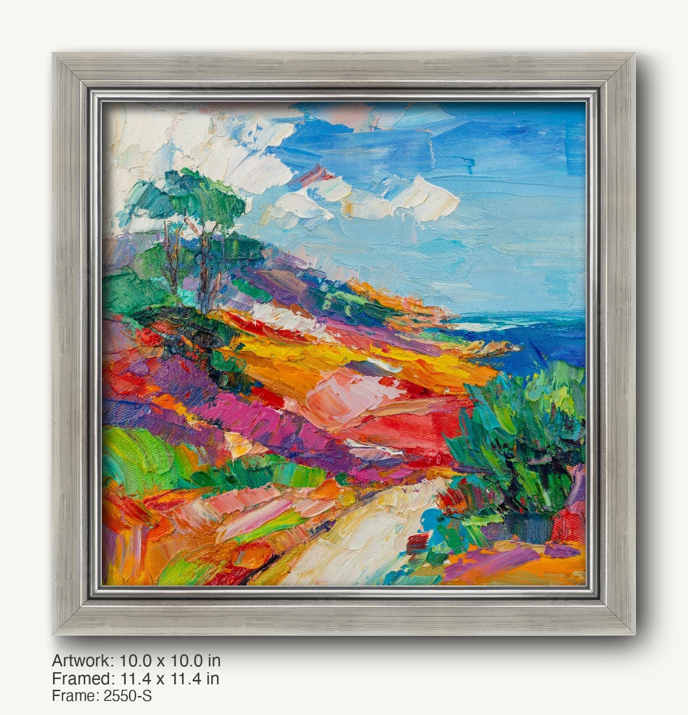 Vibrant hand-painted coastal landscape in a cool silver ornate frame, featuring bold blues, greens, and yellows on canvas with textured oil brushwork