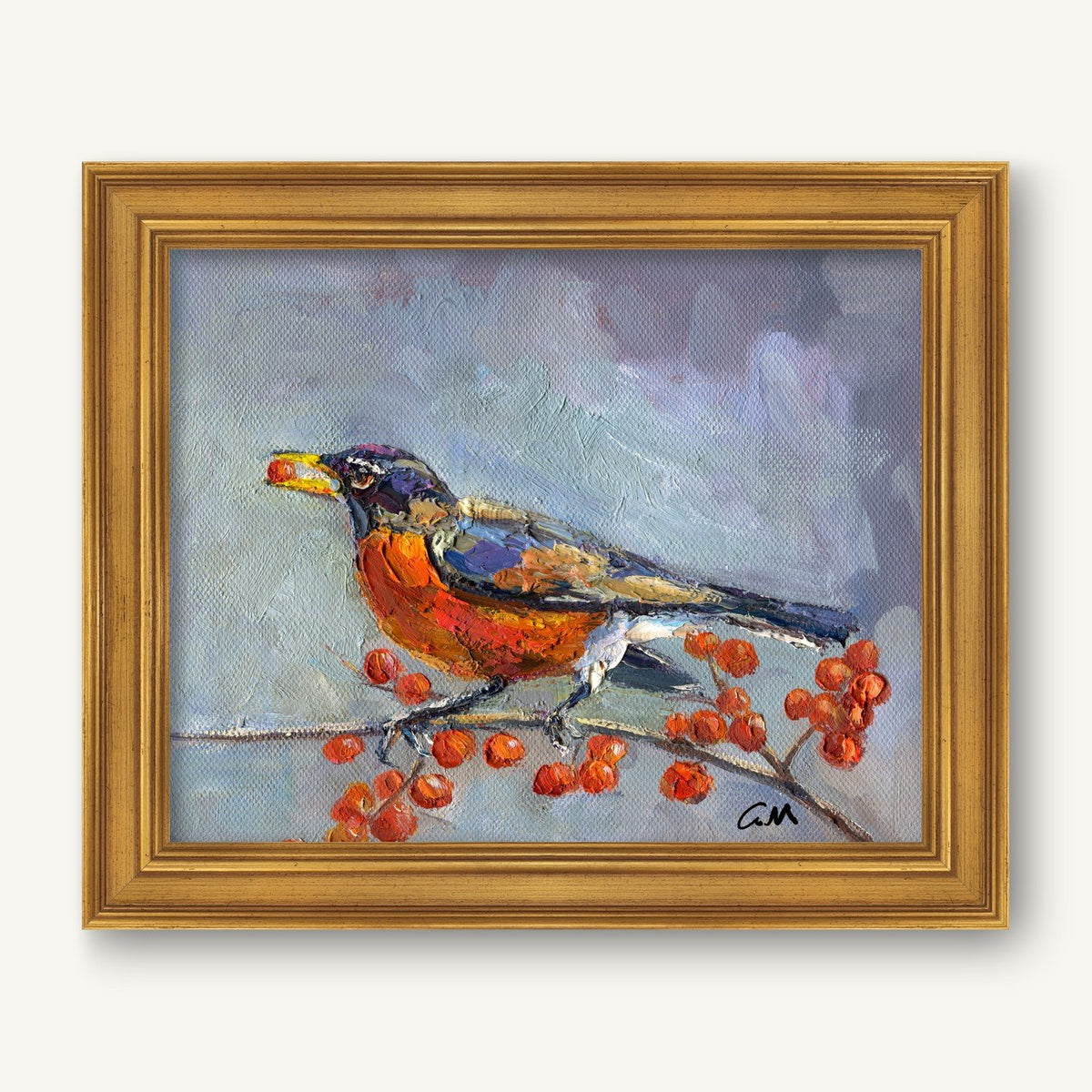Framed oil painting of a robin perched on a branch with red berries, set against a soft blue-gray background, in a gold frame