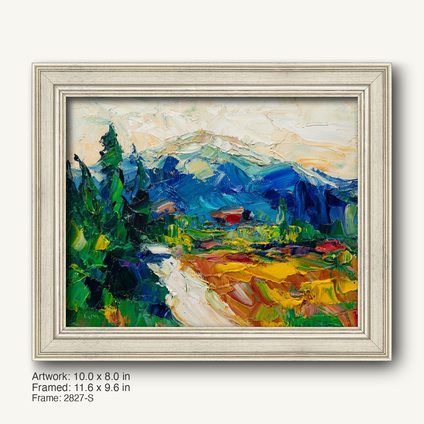 Vibrant oil painting of a mountain valley landscape in a white-washed wooden frame, featuring bold greens, blues, and yellows with textured brushwork and a signed artist signature