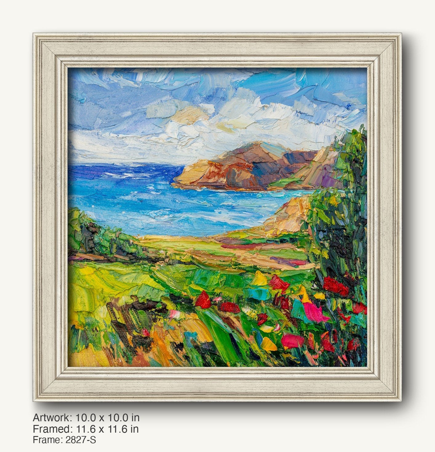 Coastal landscape oil painting in a white distressed frame, featuring vibrant blues, greens, and reds with textured brushwork and a scenic view of cliffs, sea, and fields