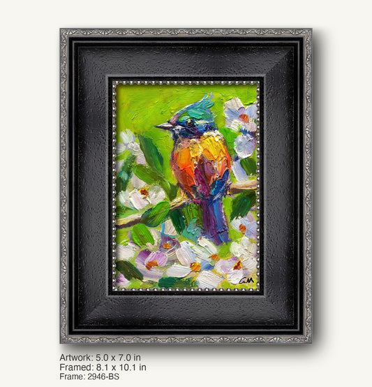 Colorful bird perched on branch amidst white flowers in vibrant oil painting, framed in black ornate frame with silver detailing