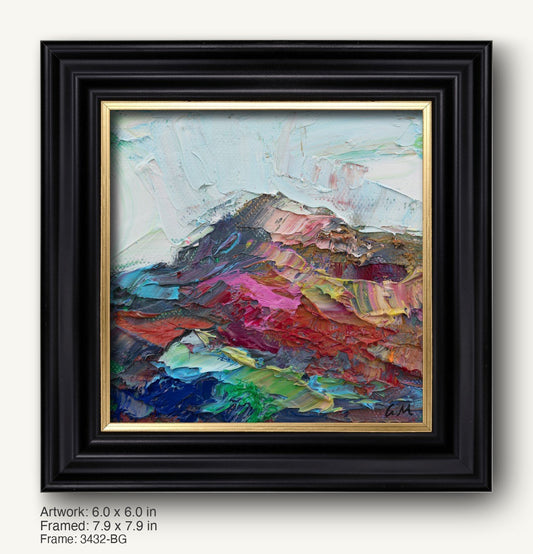 Textured abstract landscape painting in black frame with gold inner liner, featuring bold red, blue, and green hues on canvas