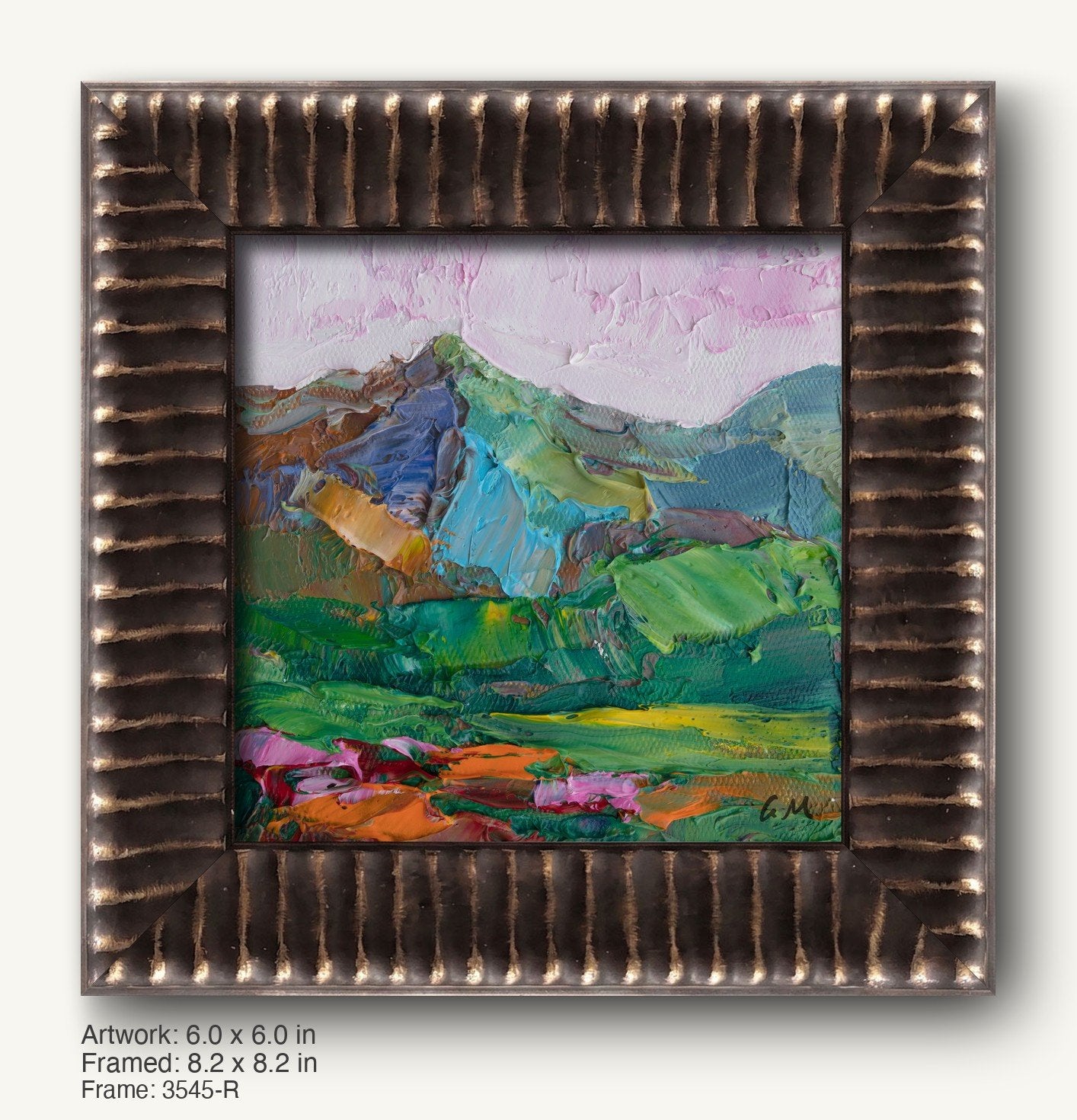 Hand-painted mountain landscape in a dark bronze textured frame with vertical ridges, showcasing vibrant greens, blues, and pinks on canvas