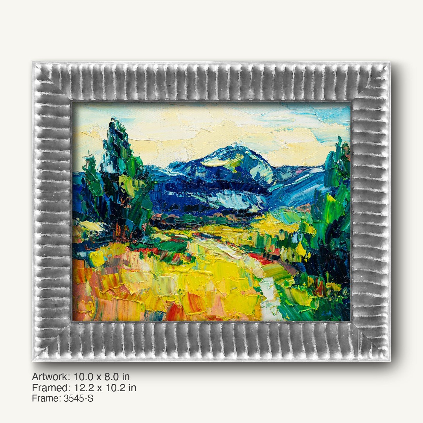 Vibrant mountain landscape oil painting in a cool silver textured frame with ribbed profile, showcasing bold blues, greens, and yellows on canvas