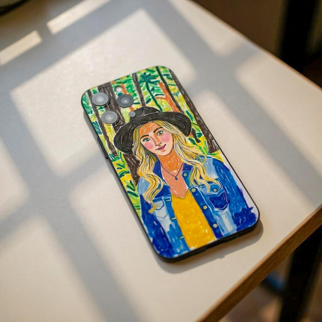 A personalized iPhone case with a custom portrait of a woman in a denim jacket and hat, set against a forest backdrop, creating a stylish and unique accessory.