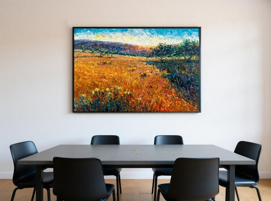 George Miller&#39;s &#39;Tuscany Sunset&#39; energizes a minimalist dining room. The painting’s thick impasto oranges, blues, and greens animate white walls above a gray table and black chairs. Black framing sharpens its vibrancy against neutral oak floors. Nature-inspired drama elevates spare elegance, proving how art transforms subdued spaces into conversation hubs.
