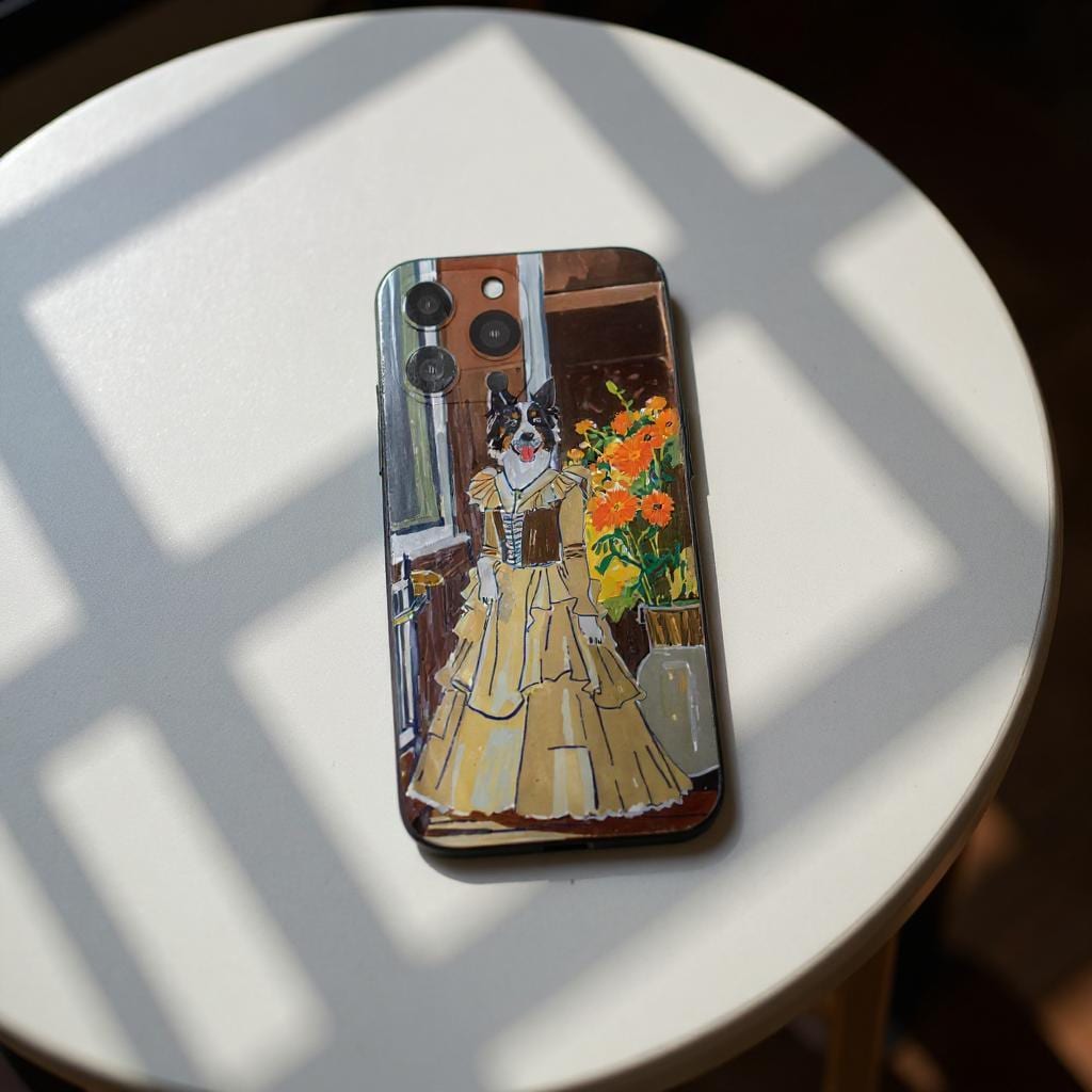 A custom pet portrait iPhone case featuring a Border Collie dressed in a vintage yellow gown, standing in front of a window with a vase of orange flowers.