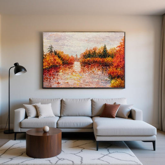George Miller&#39;s &quot;Autumn Reflections&quot; enhances a modern living room with its warm colors. The painting complements the neutral tones, creating a cozy atmosphere. The artwork adds a focal point, bringing a touch of nature indoors.