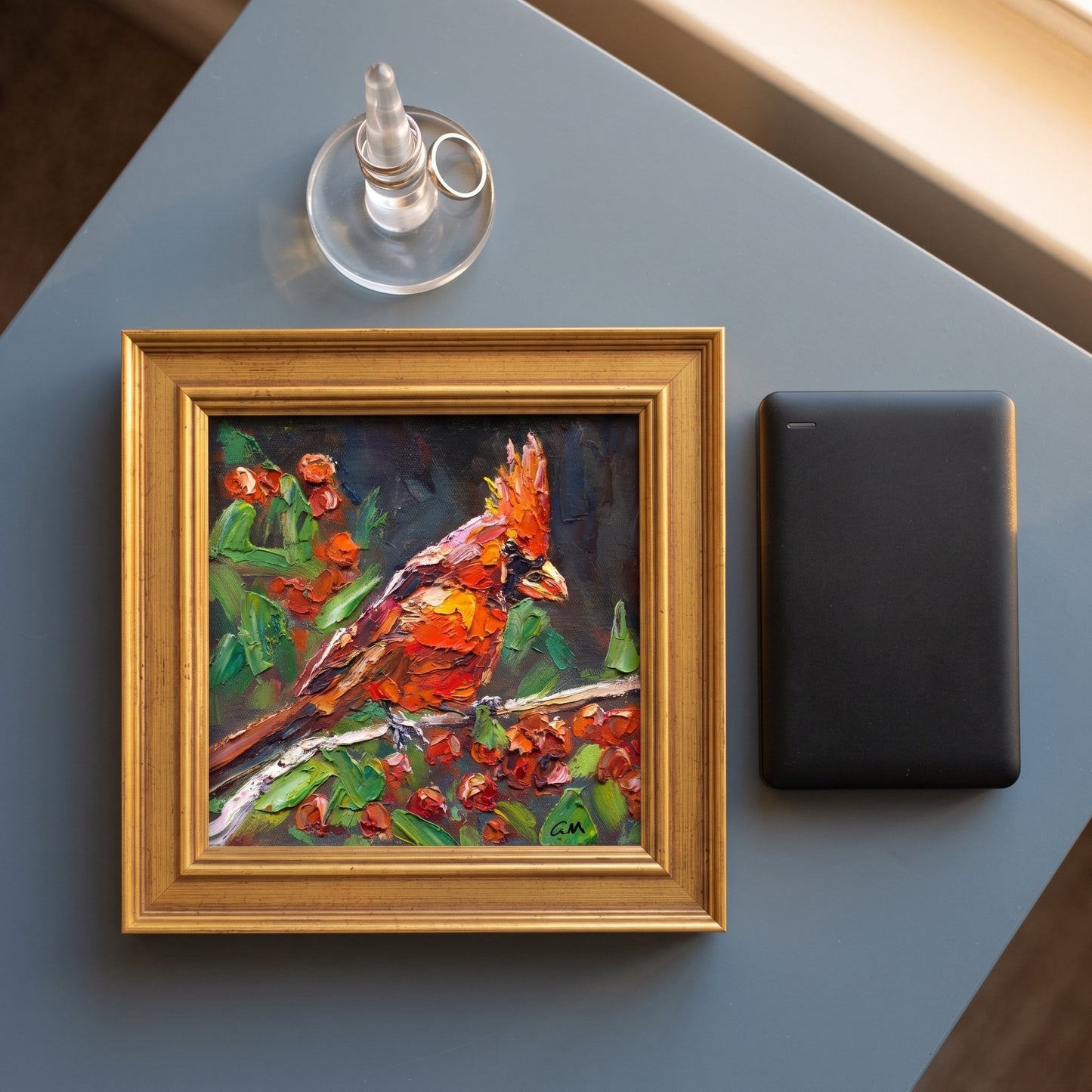 Contemporary living room — Vibrant expressionist cardinal painting adds color and life to minimalist space