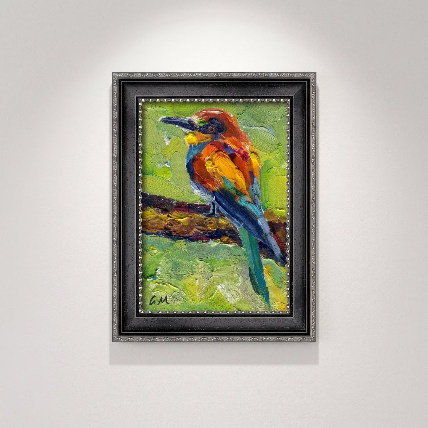 A vividly painted kingfisher perches on a branch in a textured oil canvas, framed in black with silver trim against a softly lit gallery wall.