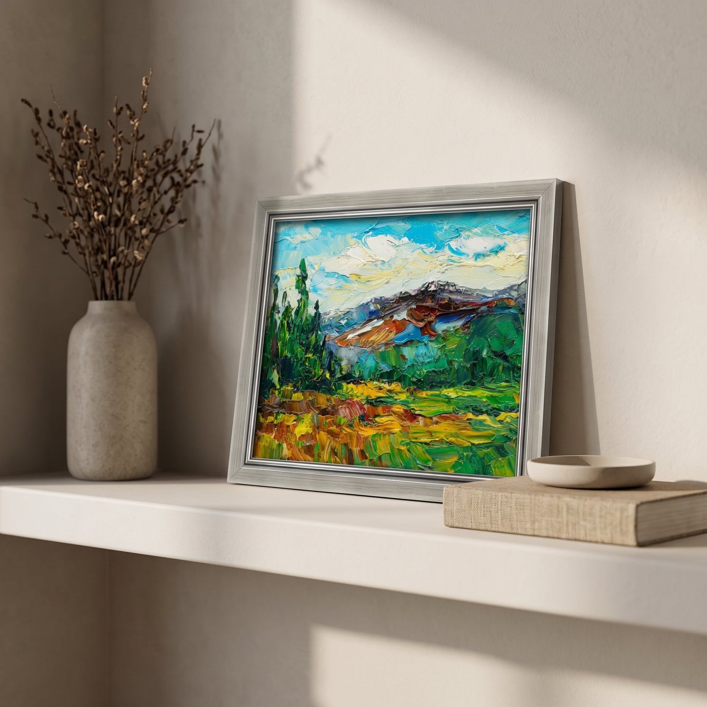Minimalist living room — vibrant Impressionist landscape adds color and life to neutral space