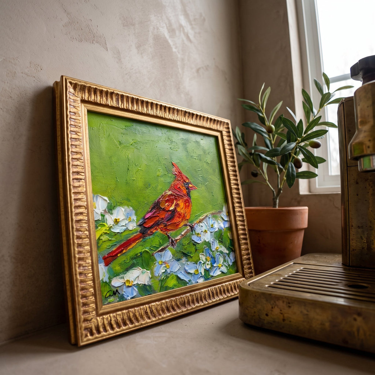 Rustic farmhouse kitchen nook — vibrant cardinal painting brings nature and color to a warm, sunlit corner