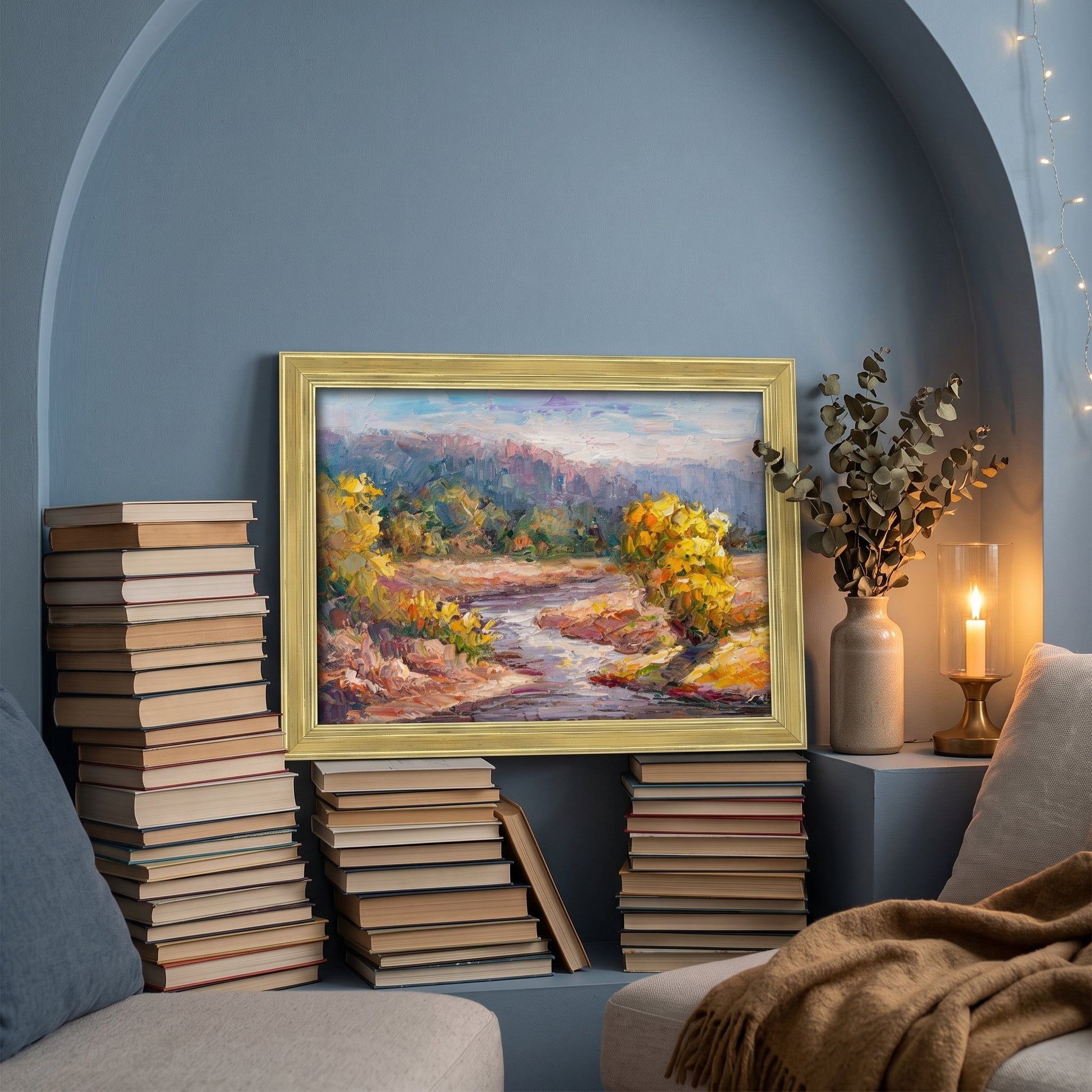 Contemporary reading nook — vibrant Impressionist landscape adds warmth and depth to serene blue space