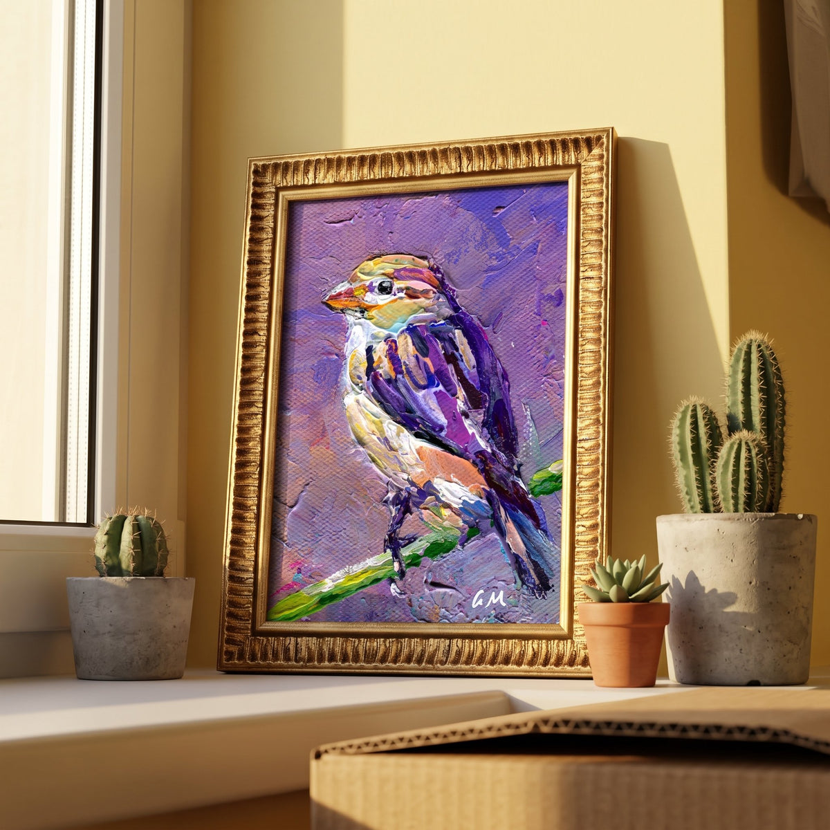 A vividly painted bird perched on a branch in expressive purple and yellow tones rests on a sunlit windowsill beside potted cacti, framed in gold.