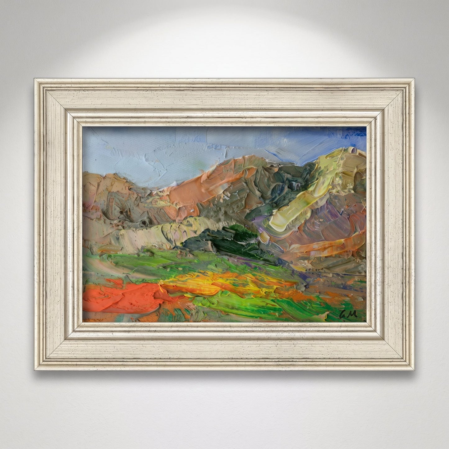 Minimalist living room — expressive landscape painting adds vibrant color and emotional depth to a serene space