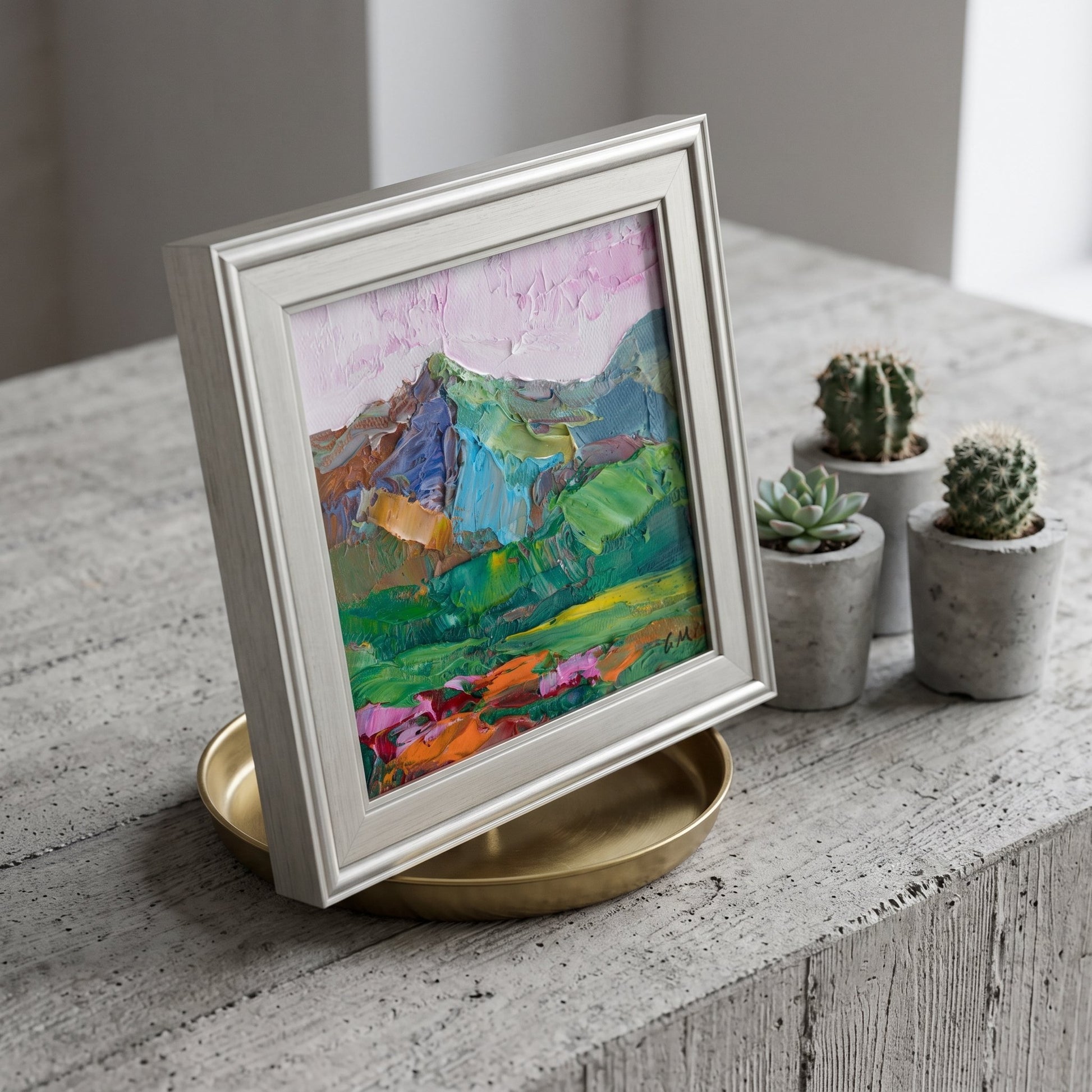 Minimalist living room — vibrant Expressionist landscape painting adds color and emotion to a serene, modern space