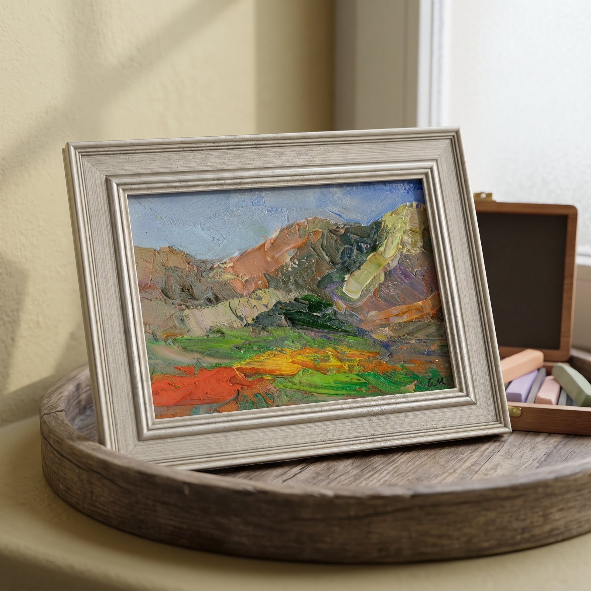 Minimalist living room — expressive landscape painting adds vibrant color and texture to a calm, neutral space
