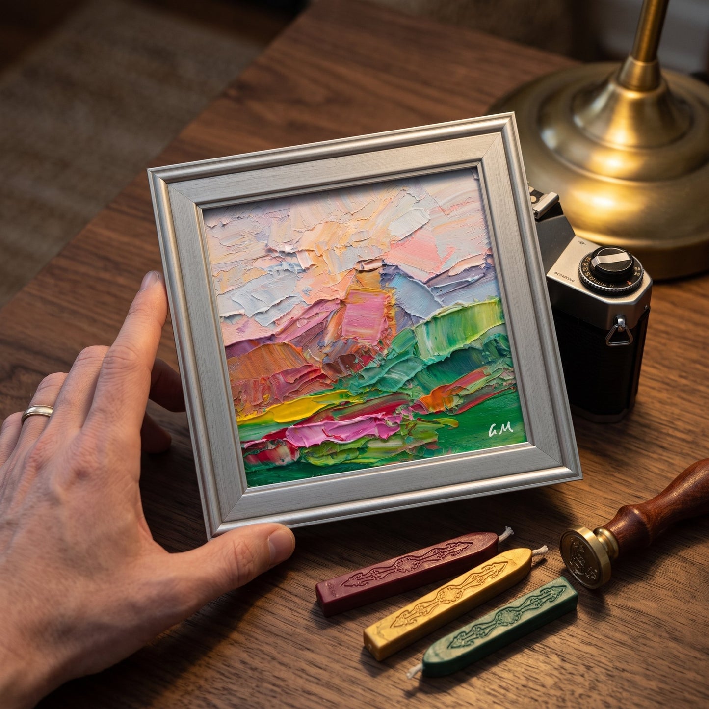 Vintage study — expressionist landscape painting adds vibrant texture and color to warm, classic decor