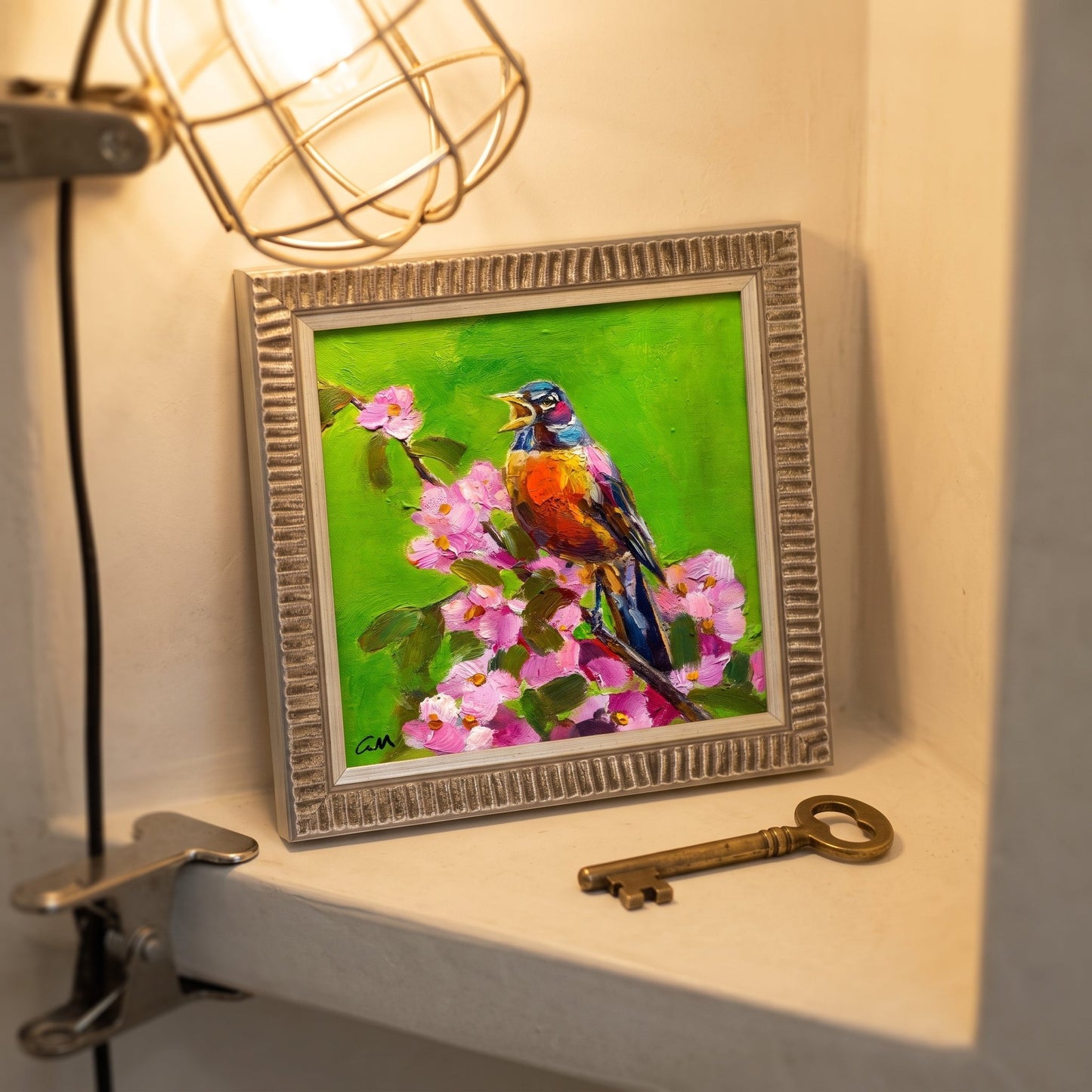Eclectic entryway — Vibrant bird painting adds nature-inspired charm and color contrast to vintage decor