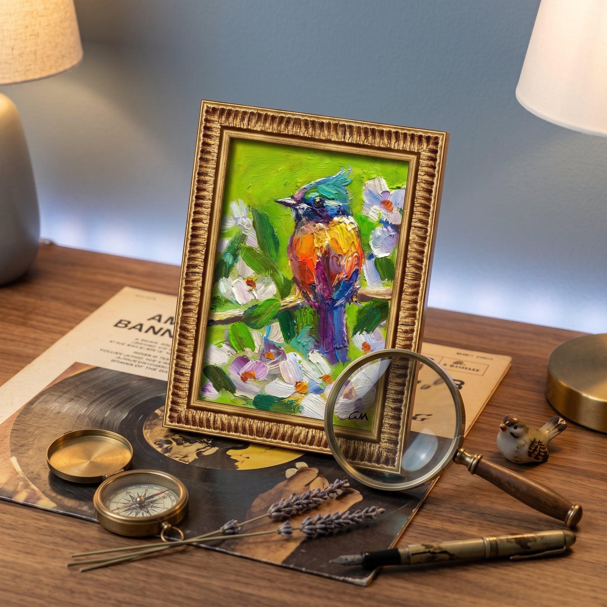 Eclectic study — vibrant expressionist bird painting adds color and character to a vintage-inspired workspace