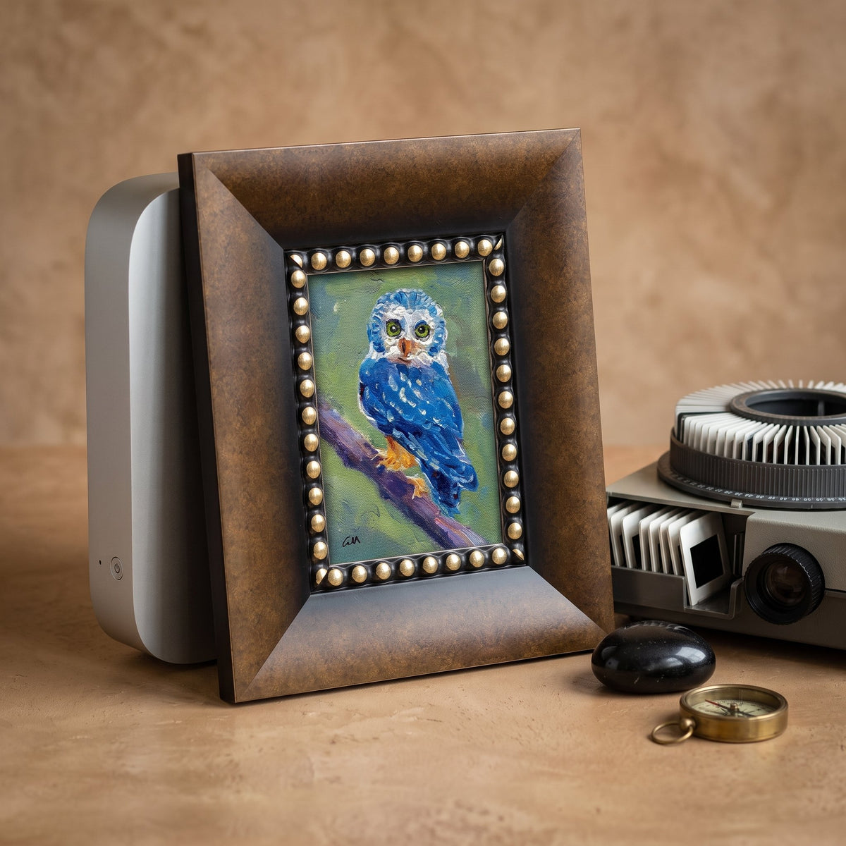 Rustic farmhouse study — Expressive blue owl painting adds vibrant focal point with textured detail and vintage charm