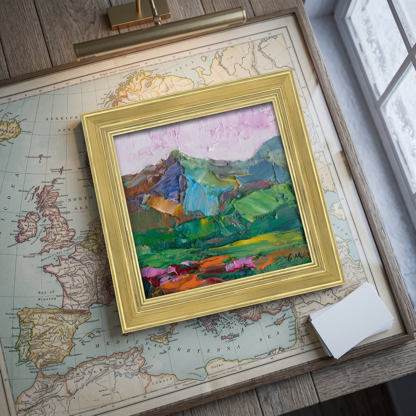 Rustic farmhouse study — expressive landscape painting adds vibrant color and emotional depth to a vintage-inspired workspace