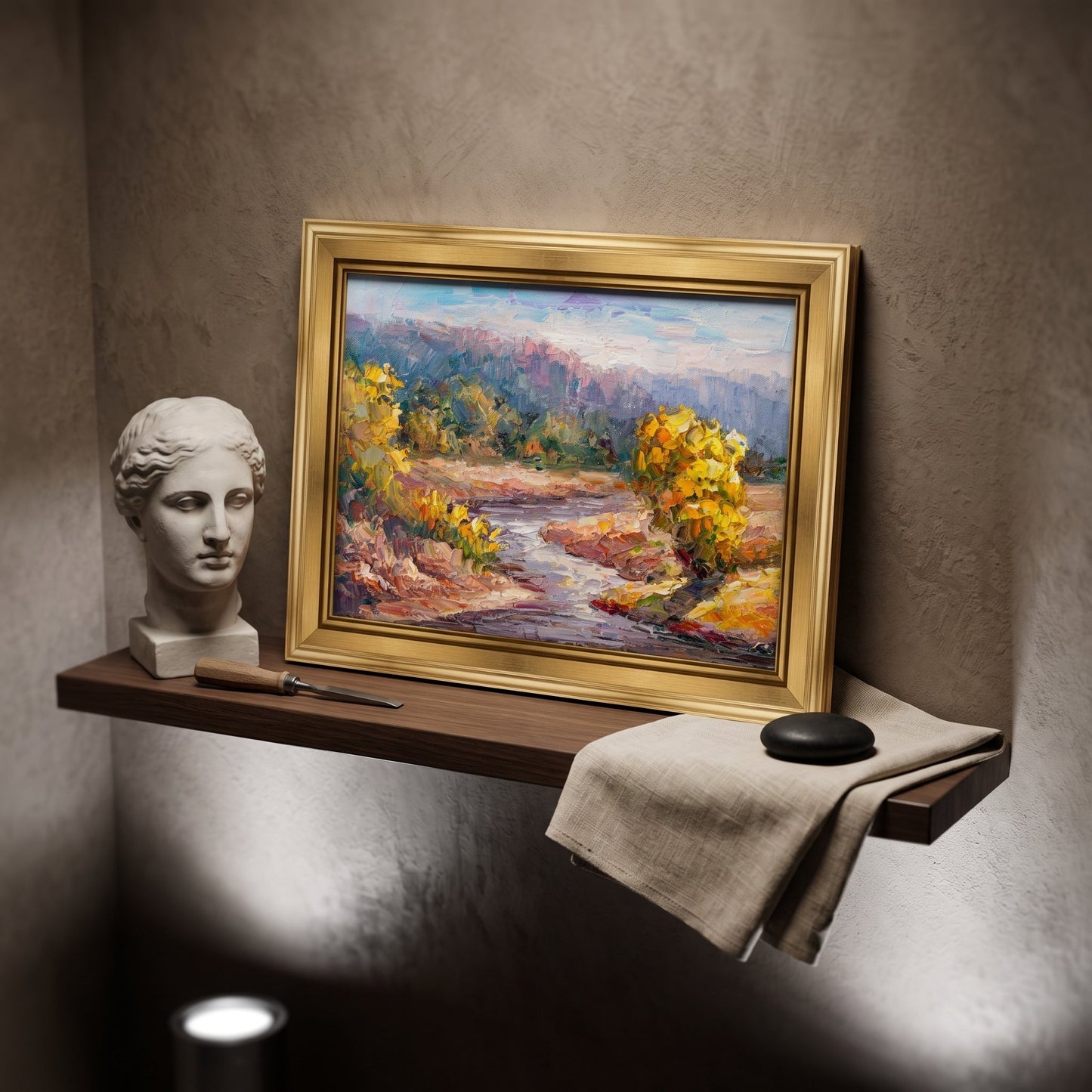Minimalist study — Impressionist landscape painting adds vibrant color and serenity to a calm, curated space